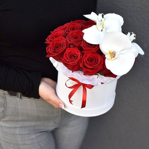 Box of red roses and orchids